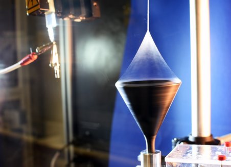 A machine spins the synthetic polymer fibers.